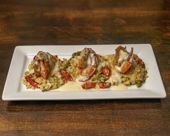 Crudo Wood Fired Taverna signature dishes Pappardelle BologneseParmesan Crusted ChickenBlue Lump Crab Stuffed Shrimp